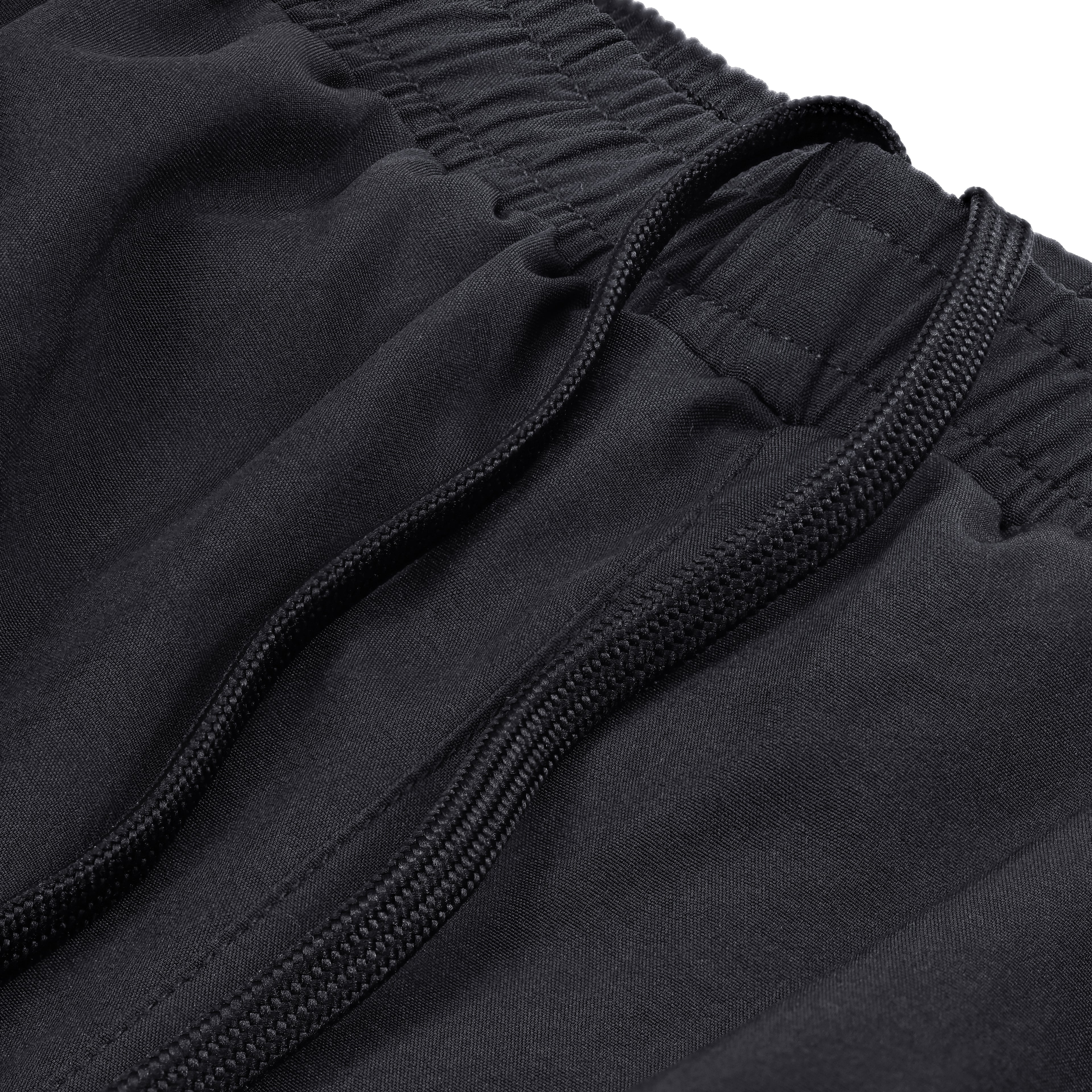 Close-up of black Court10 Performance Shorts with drawstring detail on a white background